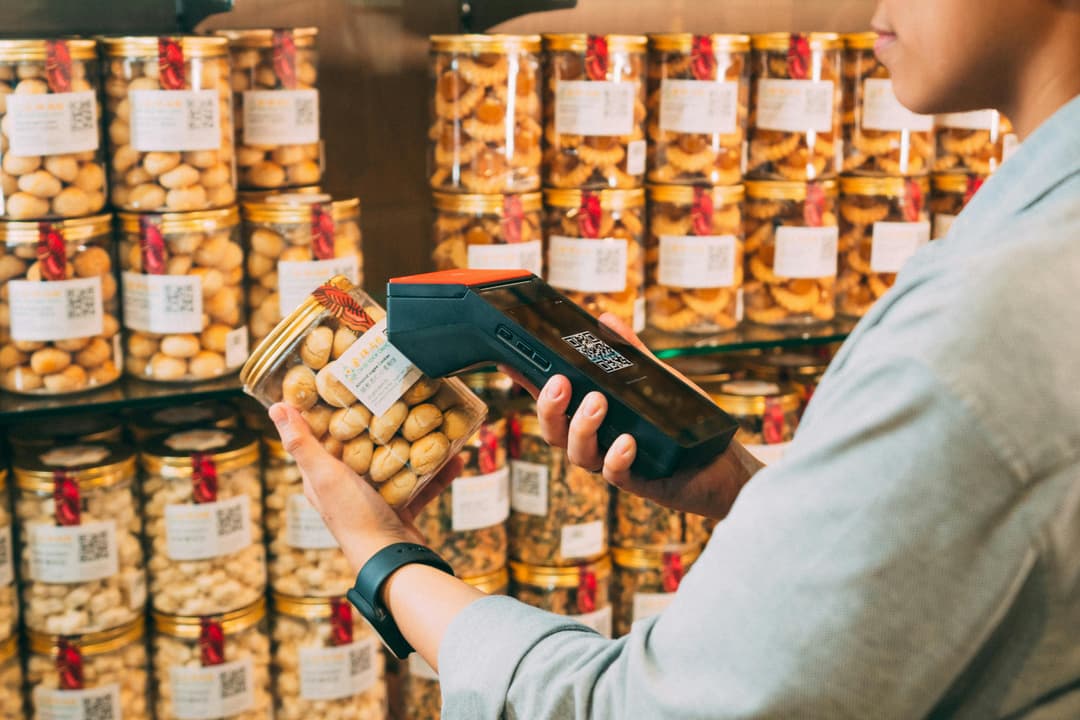 Business person scanning products